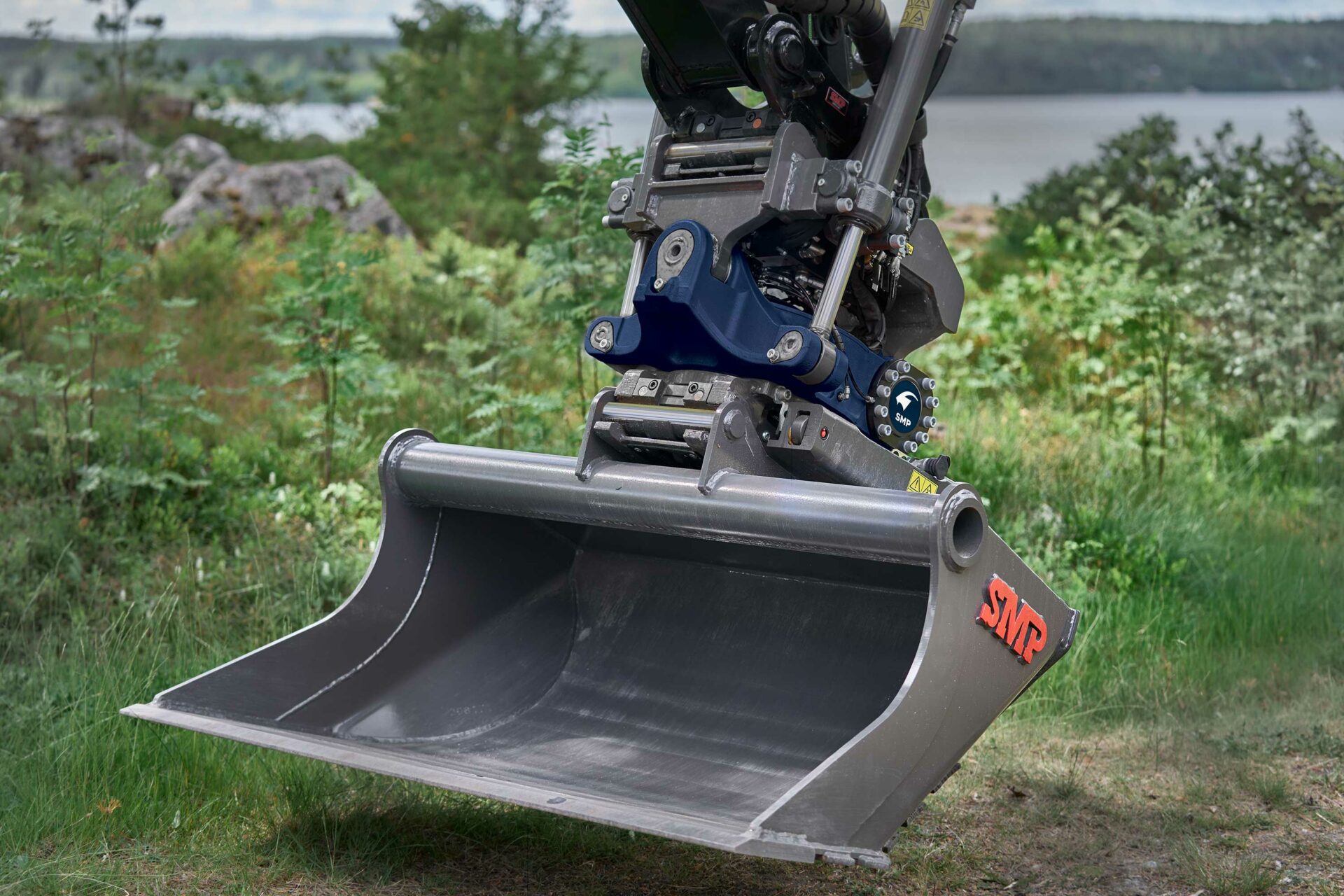 digging bucket, quick coupler and a tiltrotator outdoors in Sweden